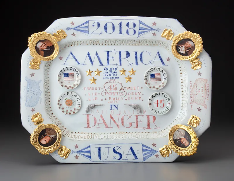 Mara Superior, “America: Danger!”, 2018 Mara Superior, “America: Danger!”, 2018, 14 x 18 x 1.5″, high-fired porcelain, ceramic oxides, underglaze, glaze. Hood Museum of Art (2019.14.1).