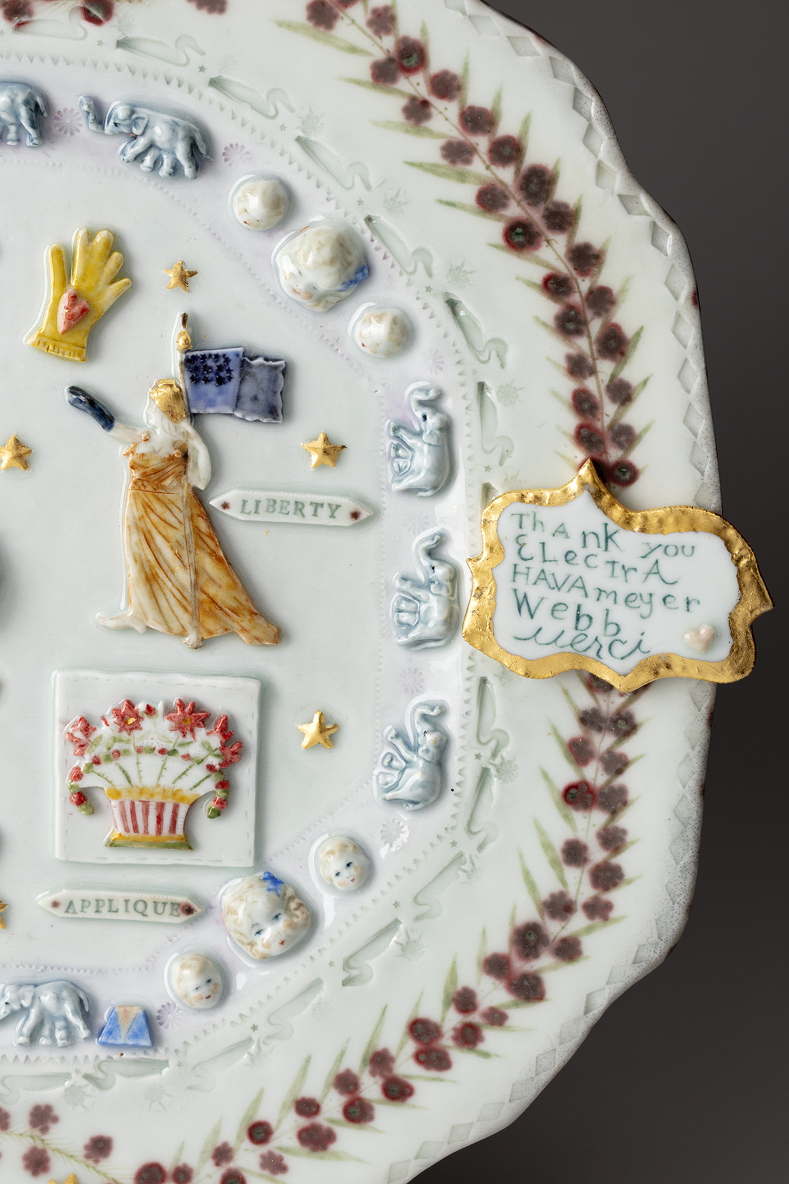 Mara Superior, “Shelburne Museum Collection Platter”, detail, 2026, high fired English porcelain, gold leaf, 15 x 17 x 1.5″